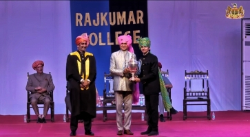 Kumar Sahib Shri Rudrapratapsinhji Lakhtar receiving tennis cup from Thakor Sahib Shri Mandhata Sinhji of Rajkot at Annual Prize Giving Ceremony Rajkumar College Rajkot.